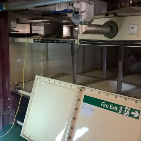 adding access panels to water storage tank